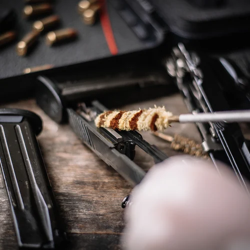 Inside Knightrunner Cleaning Station Firearm cleaning station with rod and solvent
