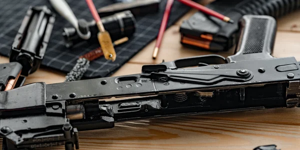 Knightrunner Expert Gunsmithing Disassembled firearm on a workbench during expert gunsmithing service