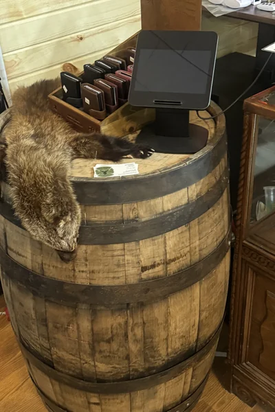 Knightrunner One On One Training Column Firearm accessories displayed on a whiskey barrel at Knightrunner Tactical